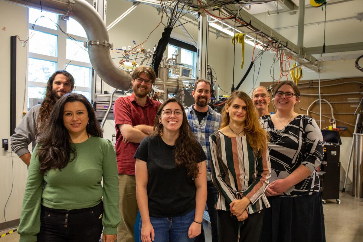 UNH nuclear physics researchers in front of polarized target